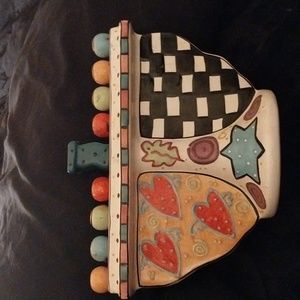 A hand crafted Hanukkah Mezuza by: Jonnane Delombiu. Very modern.